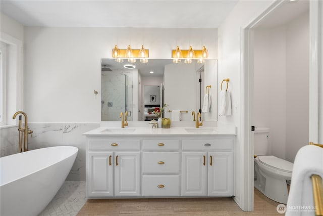 9220 NE 195th St, Bothell, WA 98011 - full bath with a marble finish shower, double vanity, a freestanding tub, a wainscoted wall, and tile walls