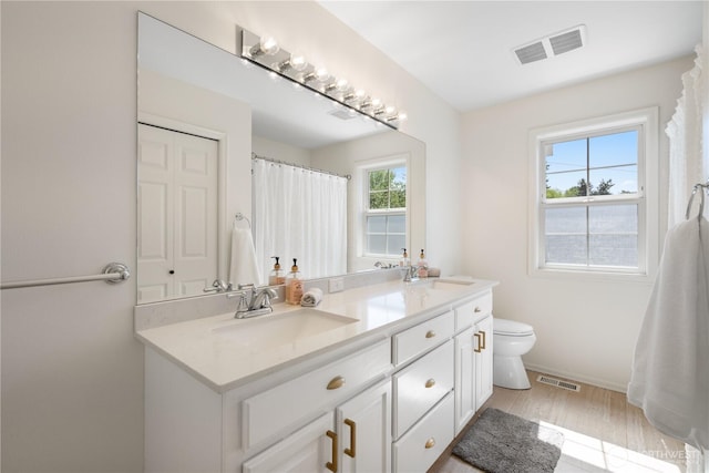 9220 NE 195th St, Bothell, WA 98011 - bathroom featuring double vanity and wood finished floors