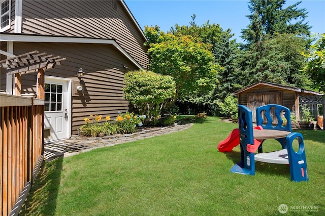 9220 NE 195th St, Bothell, WA 98011 - view of green lawn with an outdoor structure and a pergola