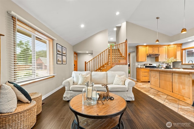 407 Leber St NE, Orting, WA 98360 - living area featuring stairway, high vaulted ceiling, and recessed lighting