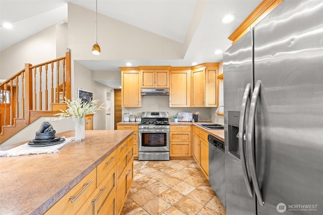 407 Leber St NE, Orting, WA 98360 - kitchen featuring stainless steel appliances, under cabinet range hood, light countertops, recessed lighting, and hanging light fixtures