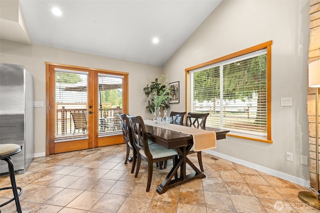 407 Leber St NE, Orting, WA 98360 - dining room with vaulted ceiling, french doors, plenty of natural light, and recessed lighting