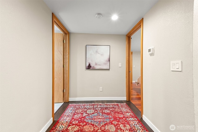 407 Leber St NE, Orting, WA 98360 - corridor with dark wood-style flooring and baseboards
