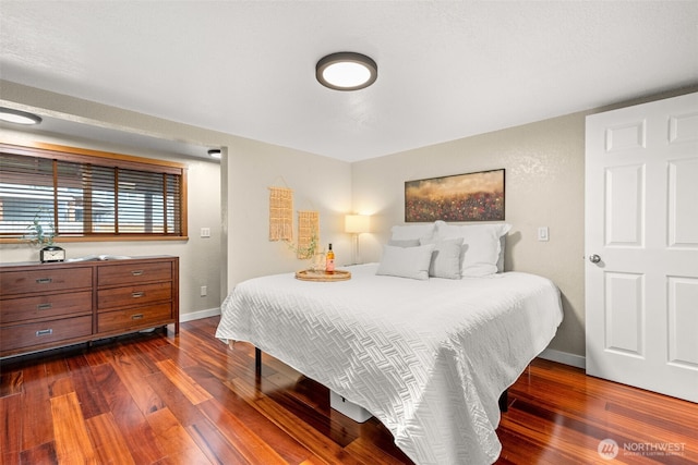 407 Leber St NE, Orting, WA 98360 - bedroom featuring dark wood-style flooring