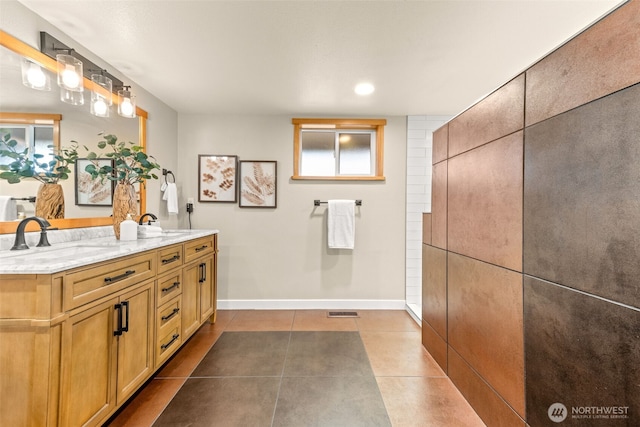 407 Leber St NE, Orting, WA 98360 - bathroom with double vanity, tile patterned flooring, and recessed lighting
