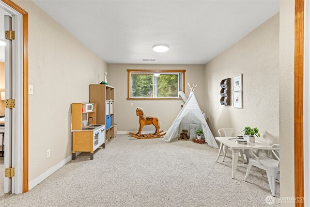 407 Leber St NE, Orting, WA 98360 - playroom with light carpet and baseboards