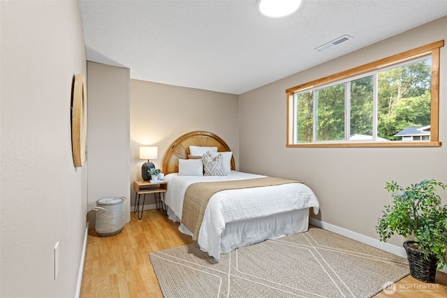 407 Leber St NE, Orting, WA 98360 - bedroom featuring light wood finished floors and baseboards