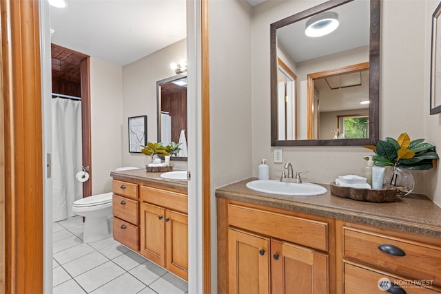407 Leber St NE, Orting, WA 98360 - full bath with tile patterned flooring, vanity, and a shower with curtain