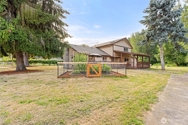 407 Leber St NE, Orting, WA 98360 - view of grassy yard featuring a vegetable garden