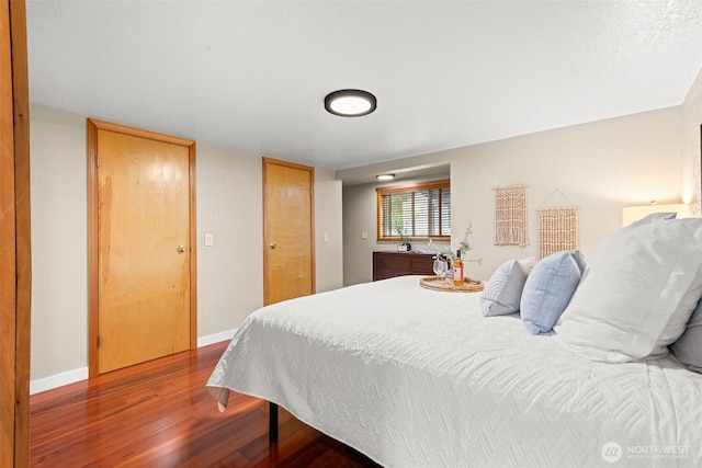 407 Leber St NE, Orting, WA 98360 - bedroom with wood finished floors and baseboards