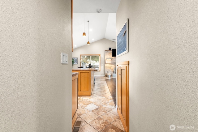 407 Leber St NE, Orting, WA 98360 - corridor with lofted ceiling and a textured wall