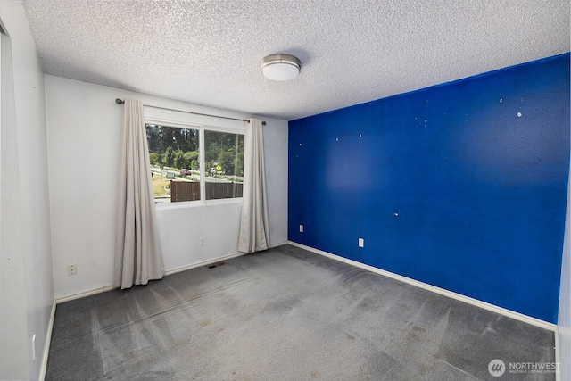 6808 NE 165th St, Kenmore, WA 98028 - carpeted empty room featuring a textured ceiling and baseboards