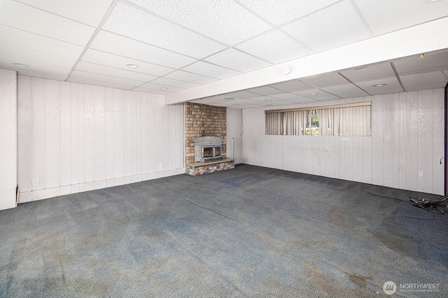 6808 NE 165th St, Kenmore, WA 98028 - below grade area featuring a paneled ceiling, carpet floors, wooden walls, and a fireplace