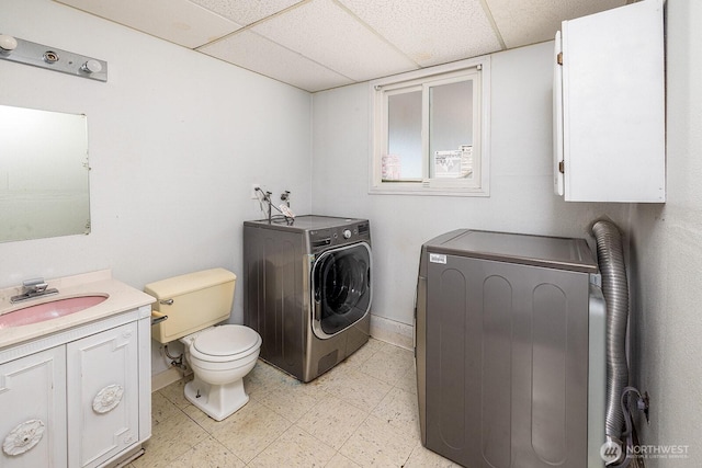 6808 NE 165th St, Kenmore, WA 98028 - washroom featuring washer and clothes dryer and light flooring