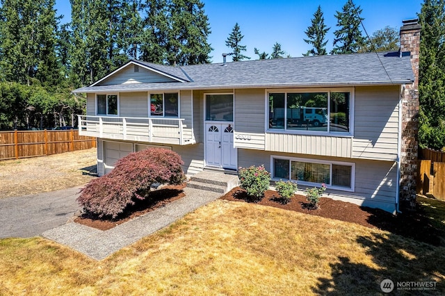 6808 NE 165th St, Kenmore, WA 98028 - split foyer home featuring a chimney, an attached garage, and roof with shingles