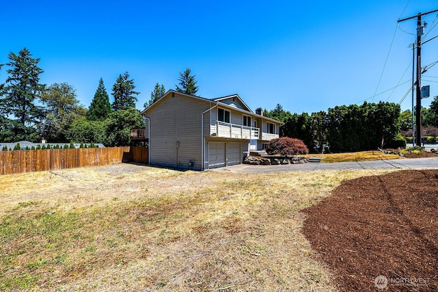 6808 NE 165th St, Kenmore, WA 98028 - view of side of home featuring a garage and driveway