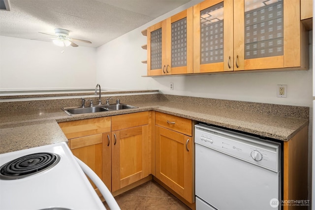 2506 S 317th St Unit 103, Federal Way, WA 98003 - kitchen with dishwasher, a ceiling fan, glass insert cabinets, tile patterned floors, and a textured ceiling