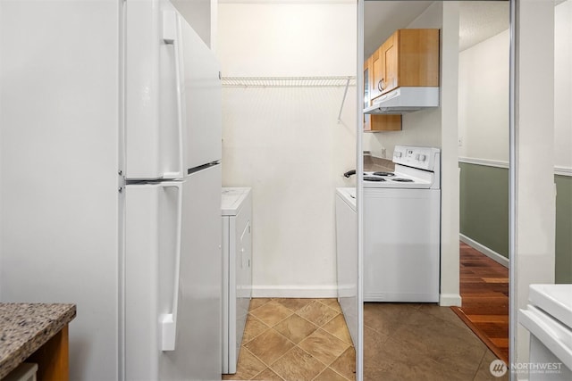 2506 S 317th St Unit 103, Federal Way, WA 98003 - kitchen with white appliances, under cabinet range hood, light countertops, and independent washer and dryer