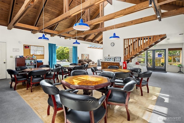 2506 S 317th St Unit 103, Federal Way, WA 98003 - dining space featuring a wooden ceiling with exposed beams, high vaulted ceiling, plenty of natural light, and stairway