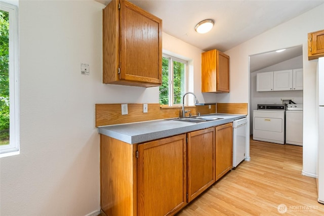 370 Van Wyck Rd, Bellingham, WA 98226 - kitchen featuring separate washer and dryer, dishwasher, light wood-type flooring, brown cabinetry, and lofted ceiling