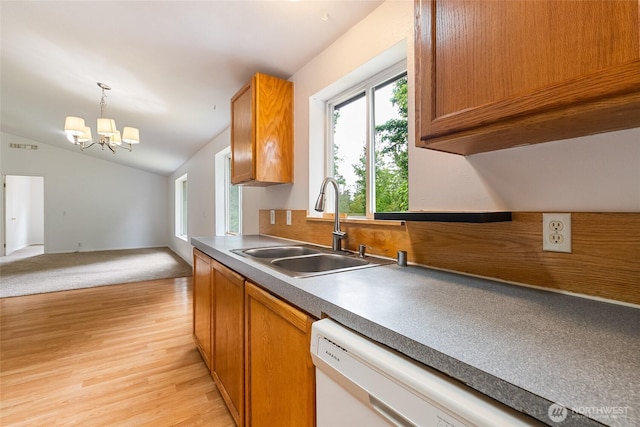 370 Van Wyck Rd, Bellingham, WA 98226 - kitchen with white dishwasher, a chandelier, vaulted ceiling, plenty of natural light, and light wood-style flooring