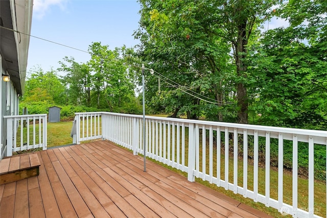370 Van Wyck Rd, Bellingham, WA 98226 - wooden terrace featuring a storage unit, a lawn, and view of wooded area