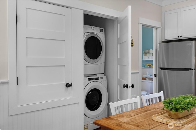 17 Beach Cabin Ln, Pacific Beach, WA 98571 - laundry room featuring stacked washing machine and dryer