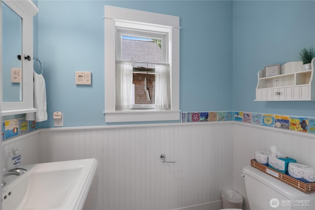 17 Beach Cabin Ln, Pacific Beach, WA 98571 - bathroom featuring a wainscoted wall and toilet