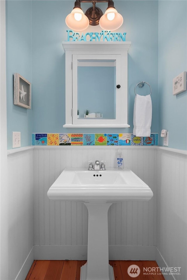 17 Beach Cabin Ln, Pacific Beach, WA 98571 - bathroom with a wainscoted wall and wood finished floors