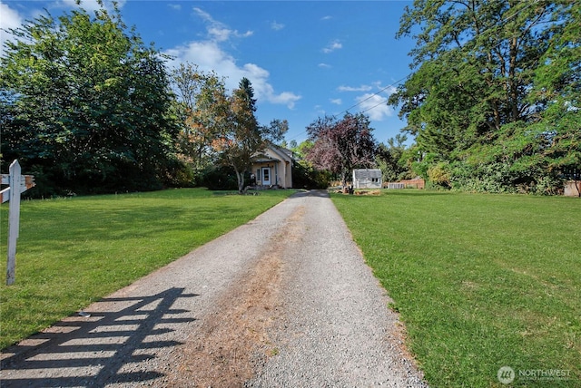 14812 SE 368th Pl, Auburn, WA 98092 - obstructed view of property with a front yard and driveway