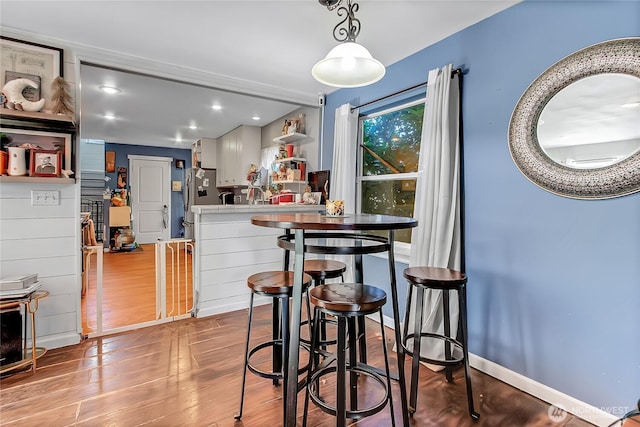 14812 SE 368th Pl, Auburn, WA 98092 - kitchen with wood finished floors, freestanding refrigerator, open shelves, recessed lighting, and pendant lighting