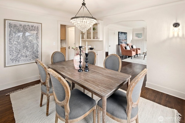 3106 NE 60th St, Seattle, WA 98115 - dining room featuring a chandelier, arched walkways, and wood finished floors