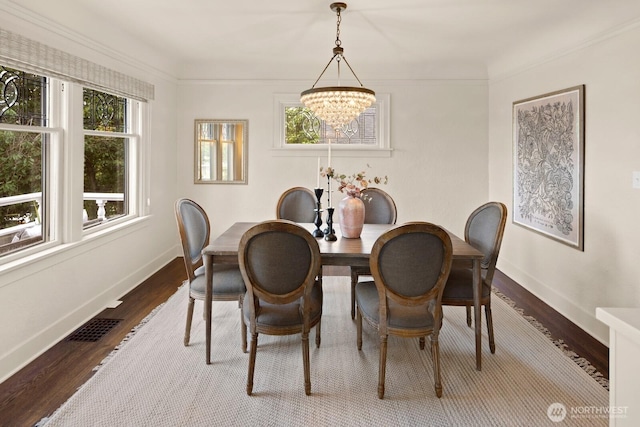 3106 NE 60th St, Seattle, WA 98115 - dining area featuring a chandelier and dark wood-style flooring