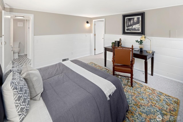 3106 NE 60th St, Seattle, WA 98115 - carpeted bedroom with wainscoting and ensuite bath