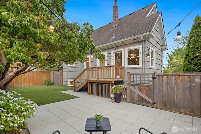 3106 NE 60th St, Seattle, WA 98115 - rear view of house with a fenced backyard, roof with shingles, a gate, a patio area, and a chimney