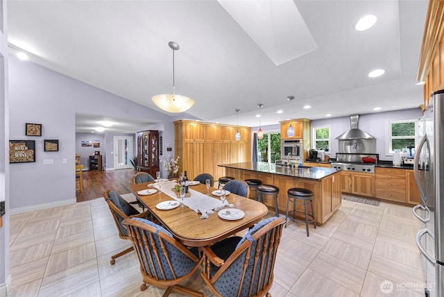 599 Loomis Trail Rd, Lynden, WA 98264 - dining room featuring vaulted ceiling, a skylight, and recessed lighting