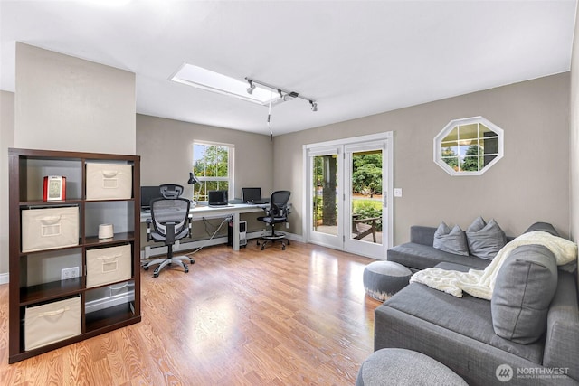 599 Loomis Trail Rd, Lynden, WA 98264 - home office featuring wood finished floors, a baseboard heating unit, and track lighting