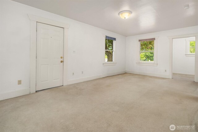 9559 College Way N, Seattle, WA 98103 - empty room with light carpet and baseboards