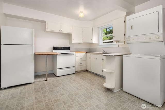 9559 College Way N, Seattle, WA 98103 - kitchen featuring white appliances, stacked washer and clothes dryer, light countertops, light flooring, and white cabinetry