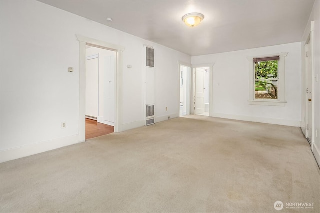 9559 College Way N, Seattle, WA 98103 - carpeted spare room featuring a heating unit and baseboards