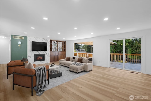 13511 SE 266th St, Kent, WA 98042 - living room featuring light wood-type flooring, healthy amount of natural light, and recessed lighting