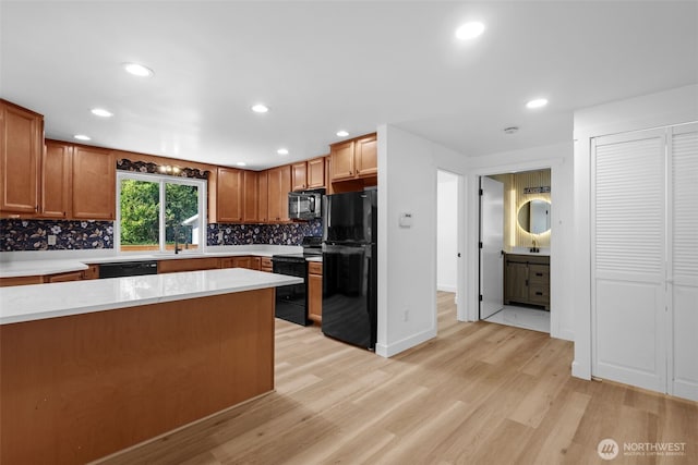 13511 SE 266th St, Kent, WA 98042 - kitchen with black appliances, light countertops, light wood finished floors, decorative backsplash, and recessed lighting