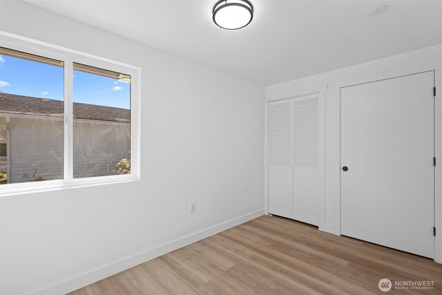 13511 SE 266th St, Kent, WA 98042 - unfurnished bedroom featuring wood finished floors and baseboards