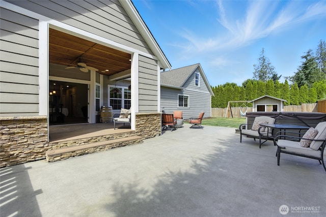 218 Lilly Ln, Mount Vernon, WA 98274 - fenced backyard featuring a patio, ceiling fan, and a storage shed