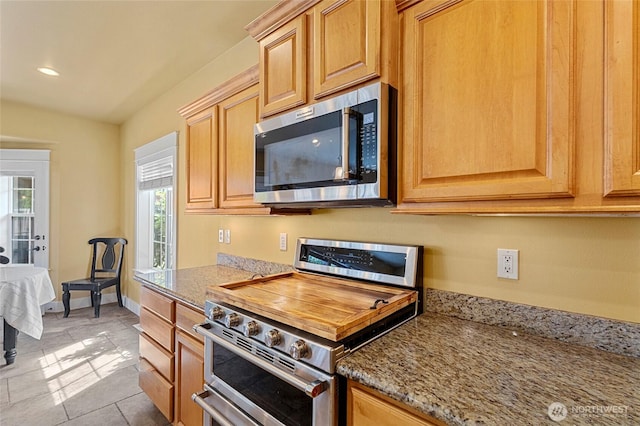 218 Lilly Ln, Mount Vernon, WA 98274 - kitchen featuring appliances with stainless steel finishes, light stone counters, recessed lighting, and tile patterned floors