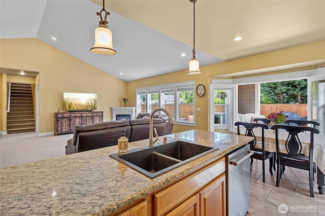 218 Lilly Ln, Mount Vernon, WA 98274 - kitchen with vaulted ceiling, open floor plan, dishwasher, decorative light fixtures, and light stone countertops