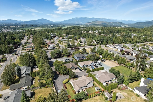 218 Lilly Ln, Mount Vernon, WA 98274 - aerial view of property's location featuring a mountainous background and nearby suburban area
