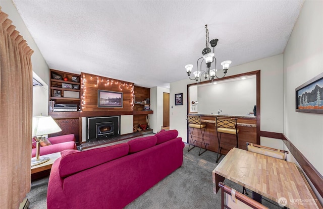 10500 Mt Baker Hwy Unit 207, Deming, WA 98244 - living area with a textured ceiling, carpet, and a chandelier