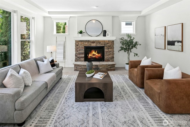 3419 NE Meadow Way, Issaquah, WA 98029 - living room with a stone fireplace, a raised ceiling, and light colored carpet