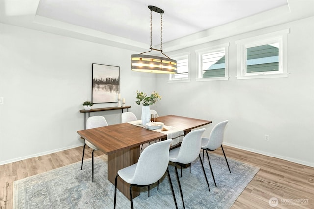 3419 NE Meadow Way, Issaquah, WA 98029 - dining area with a raised ceiling and light wood-style floors